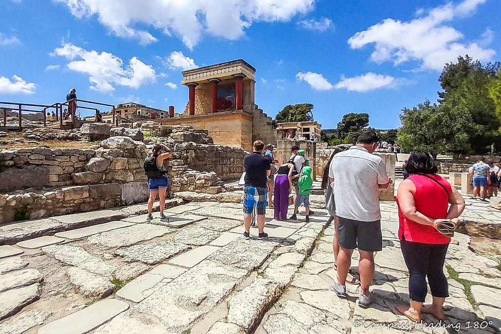 Knossos palace with its colourful fake ruins and crowds of tourists taking photos.
