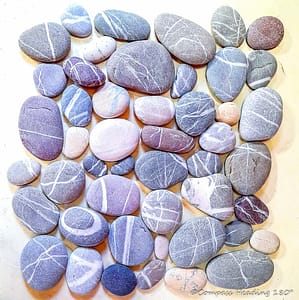 Kythera pebbles come in many colors, blue, purple and grey, but all of them have thin white lines across them to make them look special.